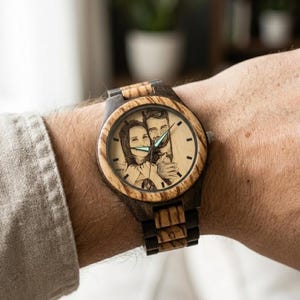 May include: A rustic wooden sign with the text "Welcome to our home" in white lettering. The sign features a distressed finish and a simple, inviting design, perfect for a front porch or entryway.