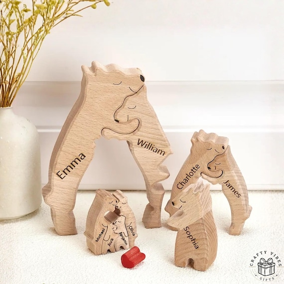 A heart-shaped wooden bear family name puzzle that doubles as a keepsake toy — clever format that works as both decor and something kids can interact with.