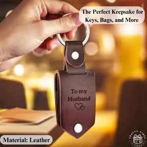 Custom Leather Photo Keychain Personalized Date Keyring Engraved Message Gift for Couple Anniversary Keepsake for Him Her Birthday Present
The engraved leather keychain displayed with a custom message, emphasizing its sentimental value as a keepsake.