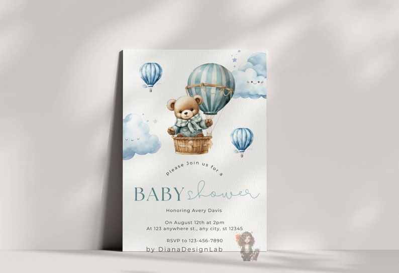 May include: A blue and white hot air balloon with a teddy bear inside. The balloon is surrounded by clouds and stars. The text "Please join us for a baby shower" is written below the balloon. The text "Honoring Avery Davis" is written below the text "baby shower". The text "On August 12th at 2pm" is written below the text "Honoring Avery Davis". The text "At 123 anywhere st., any city, st 12345" is written below the text "On August 12th at 2pm". The text "RSVP to 123-456-7890" is written below the text "At 123 anywhere st., any city, st 12345". The text "by DianaDesignLab" is written below the text "RSVP to 123-456-7890".