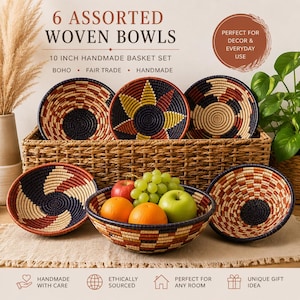 May include: A set of six assorted woven bowls featuring geometric patterns in navy, rust, and cream colors. The bowls are displayed with a rectangular woven basket and fresh fruit, including apples, oranges, and green grapes.