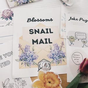 May include: A collection of stationery items with a floral theme. The central piece is a card that says "Blossoms Snail Mail" with lilac illustrations. Other items include stickers, a coloring page, and a "Joke Page" with flower graphics.