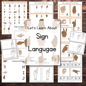 Puede incluir: Un conjunto de materiales educativos imprimibles para aprender el lenguaje de señas americano. Los materiales incluyen tarjetas del alfabeto, un juego de pescar y una hoja de decodificación. El título del conjunto es "Aprendamos el lenguaje de señas".