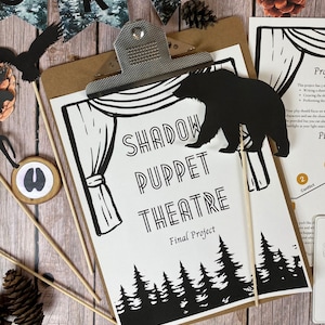 May include: A black and white printable shadow puppet theatre set with a bear, trees, and a stage curtain. The text "SHADOW PUPPET THEATRE" and "Final Project" are printed on the page.