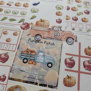 May include: A printable worksheet for kids featuring a pumpkin patch theme. The worksheet includes a truck filled with pumpkins, a number 9, and the words "Pumpkin Patch". There are also other activities on the worksheet, such as counting, matching, and drawing.