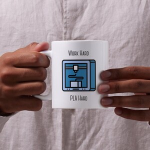 May include: White ceramic mug with a blue and black 3D printer graphic and the text "Work Hard PLA Hard".