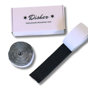 May include: A roll of black hook and loop tape with a white backing, a roll of white hook and loop tape with a black backing, and a white box with the text "Disher Pedalboard Mounting Tape" printed on it.