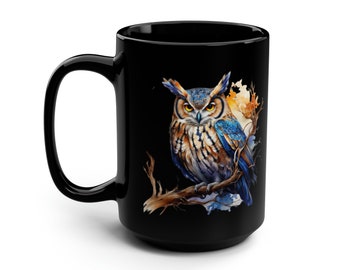May include: Black ceramic coffee mug featuring a colourful owl perched on a branch. The owl has brown, blue and yellow feathers. The background is black.