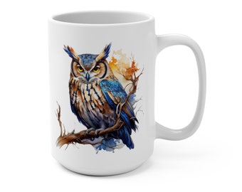 May include: White ceramic mug featuring a colourful illustration of an owl perched on a branch. The owl has brown, blue, and white feathers and yellow eyes. The background is a watercolour wash of orange and blue.