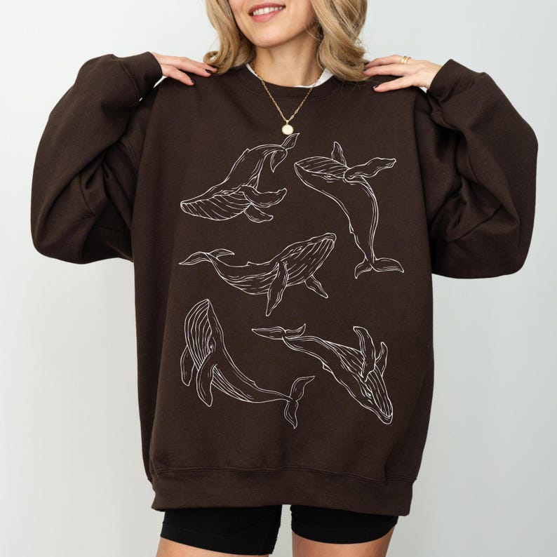 fine line art humpback whale sweater brown