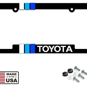 May include: Black license plate frame with the word "TOYOTA" in white. The frame has a black border with white, light blue, and dark blue stripes. Includes mounting hardware and a "Made in the USA" sticker.