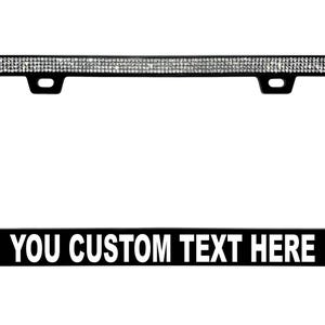 May include: Black license plate frame with a border of sparkling rhinestones. The bottom of the frame has the text "YOU CUSTOM TEXT HERE" in white letters.