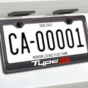 May include: A car license plate with the registration "CA-00001" in black on a white background, set within a carbon fibre-effect frame. The frame also displays "YOUR STATE", "PREMIUM LICENSE PLATE FRAME", and "Type S" in red.