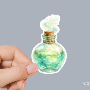 May include: A sticker featuring a watercolor illustration of a potion bottle. The bottle is filled with a swirling green liquid and topped with a cork. Wisps of light blue vapor and gold stars emanate from the bottle, creating a magical effect.