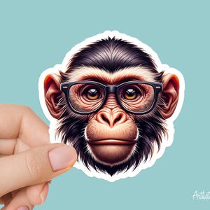 May include: A close-up of a monkey wearing black-rimmed glasses. The monkey has dark brown fur and a serious expression.