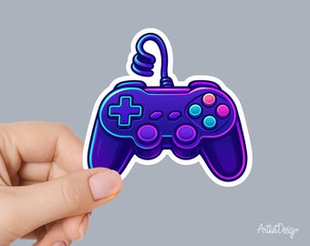 May include: A vibrant sticker of a video game controller in shades of purple, blue, and pink. The controller features a cross-shaped directional pad, colored buttons, and a looped cable. The design has a neon glow effect and a white border.