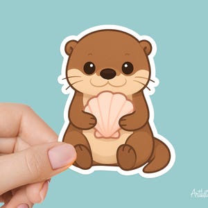 May include: A sticker featuring a cartoon otter holding a seashell. The otter is brown with a tan belly and a black nose and eyes. The seashell is light pink. The sticker has a white border and is set against a light blue background.