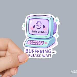 May include: A sticker featuring a cute cartoon computer with a smiling face and the text "BUFFERING... PLEASE WAIT." The computer is light blue and purple with a heart on the base.