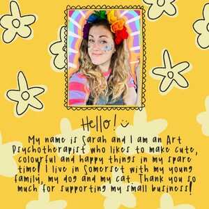 May include: A portrait of a woman with long wavy hair, wearing a colorful flower crown and glitter. The image is on a yellow background with flower illustrations and text that reads "Hello!" and a description of the artist.