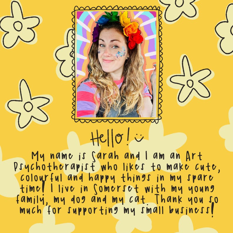 May include: A portrait of a woman with long wavy hair, wearing a colorful flower crown and glitter. The image is on a yellow background with flower illustrations and text that reads "Hello!" and a description of the artist.