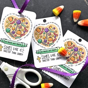 May include: White gift tags with a heart-shaped candy design, featuring lollipops, pumpkins, and candy corn. The tags have the text "God's Love is Sweeter Than Candy!" and are tied with purple ribbon.