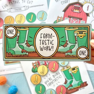 May include: A green and brown printable reward coupon with the text "FARM-TASTIC WORK!" and the words "ONE" on each side. The coupon features a cartoon illustration of two green rubber boots with brown mud.