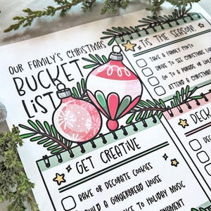 May include: A printable Christmas bucket list with a green and pink color scheme. The list includes items like "Take a family photo", "Drive to see Christmas lights", and "Attend a Christmas parade".