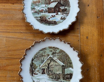 Set of Currier and Ives gold trimmed hanging wall plates