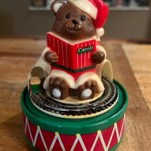 Vintage hard plastic Santa bear music box with rotating train