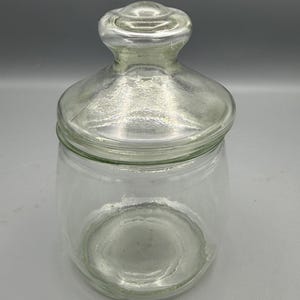 Old apothecary jar with round top knob