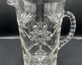 EAPG Star pattern prescut glass pitcher with ribbed handle