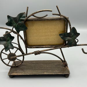 Vintage metal wheelbarrow and ivy picture frame