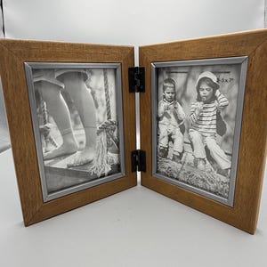 May include: A white ceramic mug with a black handle and the text "But first, coffee" in a black, handwritten-style font. The mug is on a white surface.