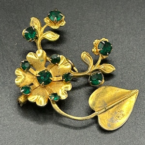 Vintage brooch of gold and green flowers