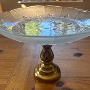 Beautiful frosted glass serving dish tray with roses and leaves and scalloped edges attached to a brass pedestal base