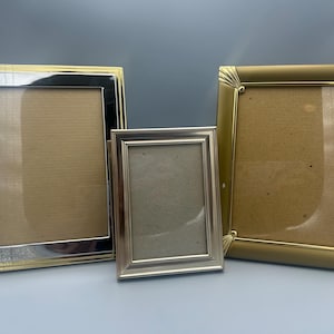Lot of gold frames, two 5”x7”, one 4”x6”