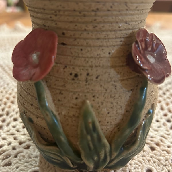 Floral pottery bud vase with raised flowers and leaves