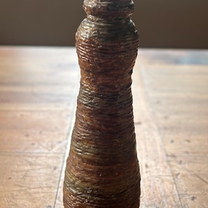 Glass jar/vase covered in pottery
