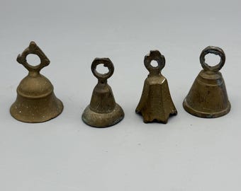 Four small etched brass bells with looped hanging handles
