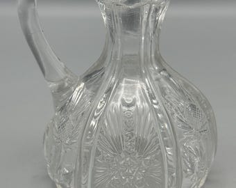 EAPG clear glass cruet with sunburst and floral motif