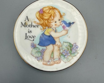 Miniature collectible plate, “A Mother is Love”