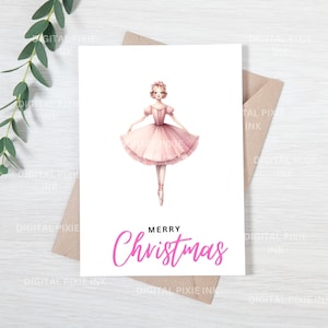 May include: A pink Christmas card featuring a ballerina in a pink tutu and a floral crown. The text "Merry Christmas" is written in pink letters.
