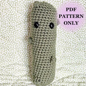 May include: A crochet pattern for a green, amigurumi Groot character. The pattern is available as a PDF download only.