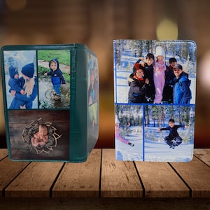 May include: Two green photo albums with different family photos on the covers. The album on the left has photos of a baby, a young boy, and a woman holding a baby. The album on the right has photos of a family in the snow.