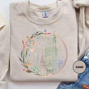 a sweater with a picture of a castle on it