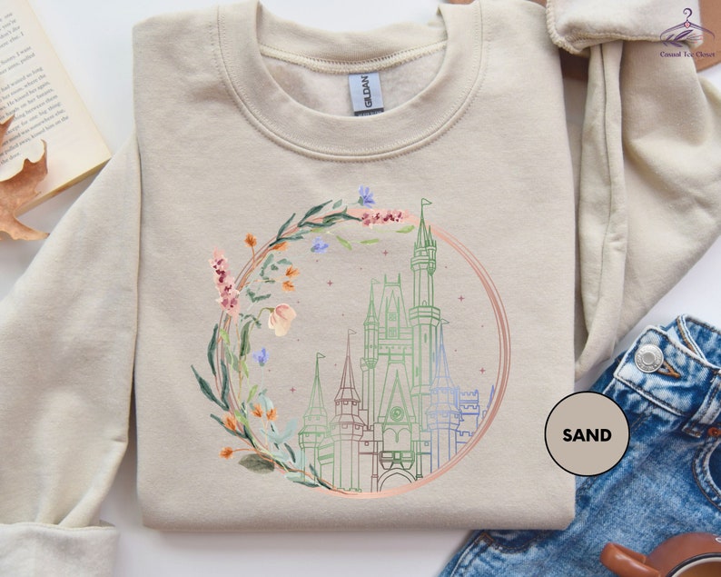 a sweater with a picture of a castle on it