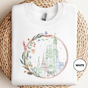 a white tshirt with a picture of a castle on it