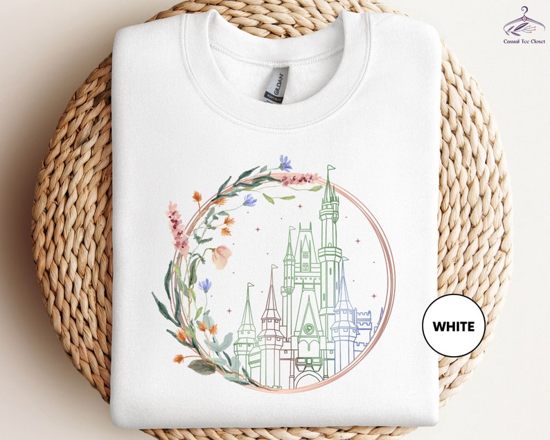 a white tshirt with a picture of a castle on it