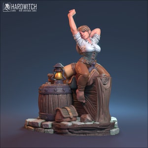 May include: A miniature figurine of a woman in a white shirt, brown trousers, and a corset, sitting on a wooden barrel with a lantern and a chest beside her. The figurine is painted in a realistic style and has a detailed sculpt.