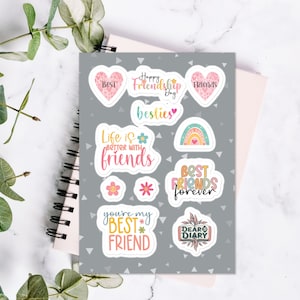 May include: A sheet of colourful stickers with various friendship-themed designs. The stickers feature phrases like "Happy Friendship Day", "Best Friends Forever", and "Life is Better with Friends".